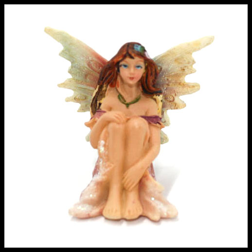 Fairy Sitting With Rainbow Wings