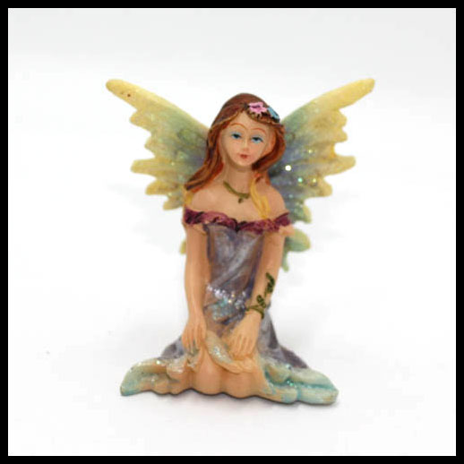 Fairy Sitting With Rainbow Wings