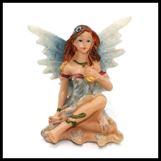 Fairy Sitting With Rainbow Wings